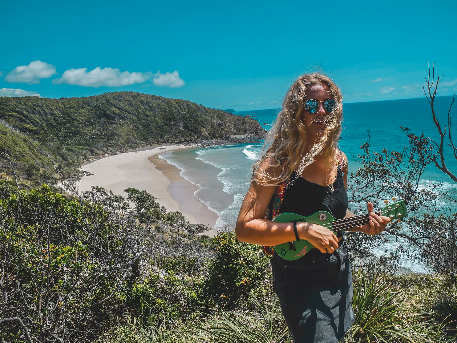 Young girl standing with views beach scenes behind her