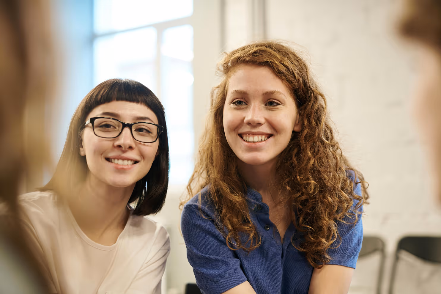 Two female students sitting in class